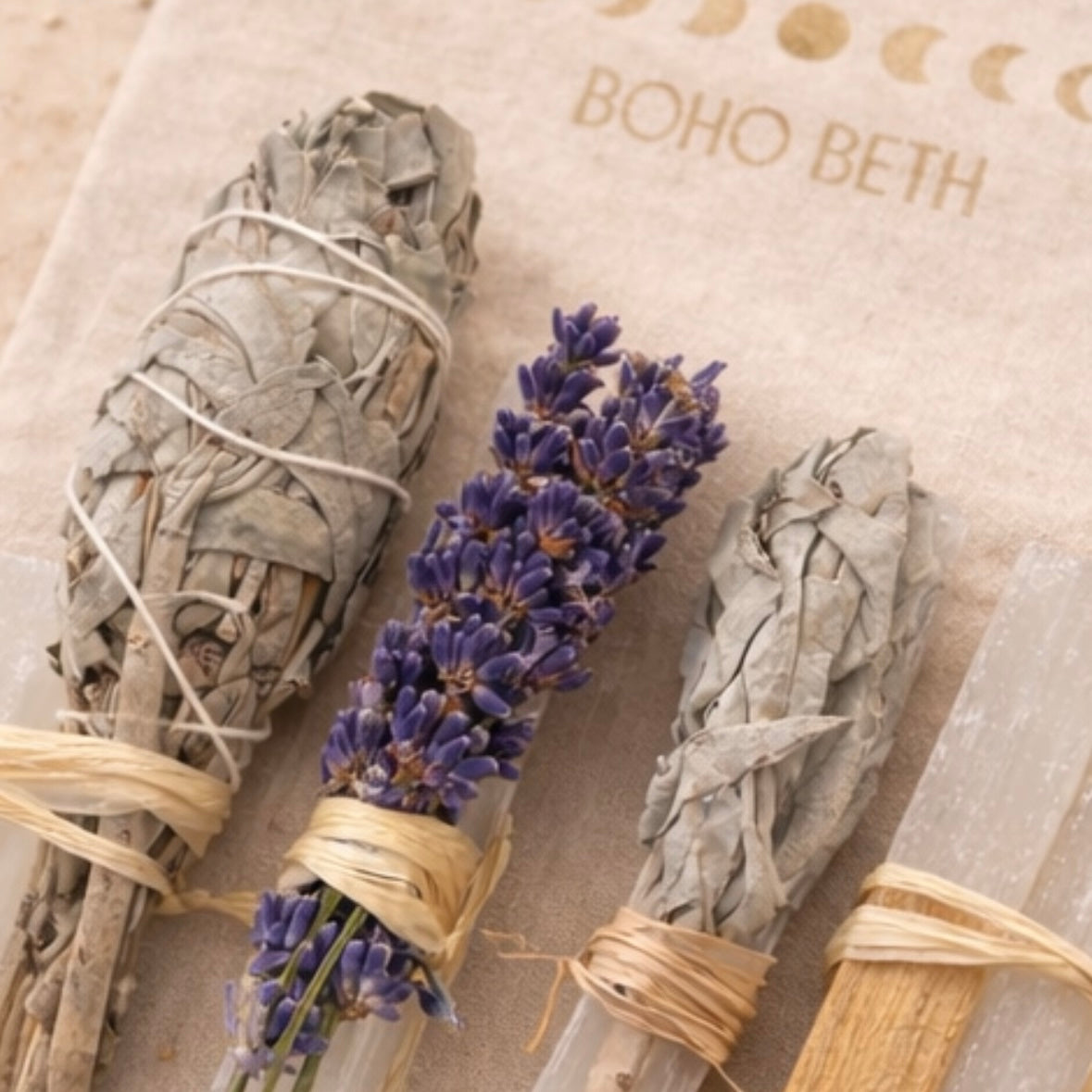 Close up of Boho Beth sage cleansing kit with white sage, lavender bundle and selenite crystals for smudging and spiritual home cleansing