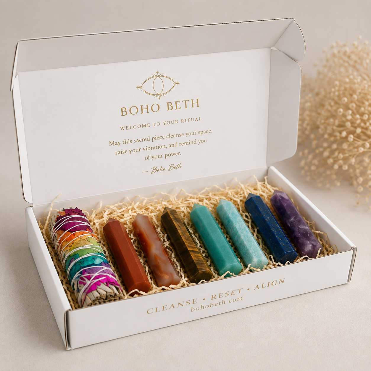 Seven chakra crystal points with colourful sage in a Boho Beth chakra smudge kit for smoke cleansing and ritual use.