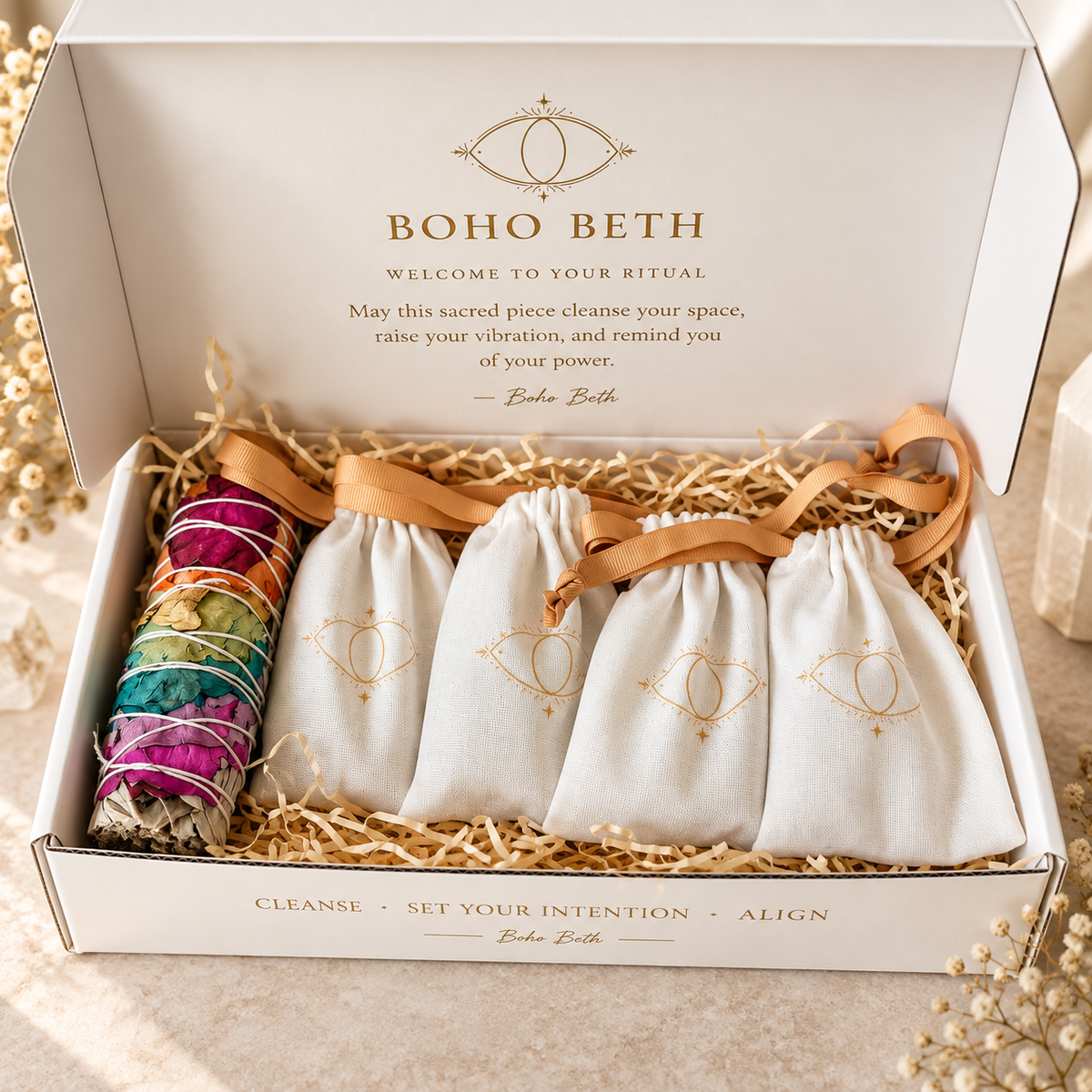 Boho Beth chakra smudge kit packaged with chakra sage and individual drawstring pouches containing seven crystal points.