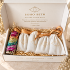Boho Beth chakra smudge kit packaged with chakra sage and individual drawstring pouches containing seven crystal points.