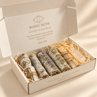 Energy cleansing smudge kit in cream gift box with white sage, lavender, rosemary, Palo Santo and crystals