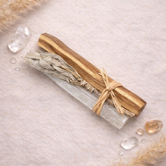Boho Beth Palo Santo Stick and Selenite bundle on a textured surface with small crystals around