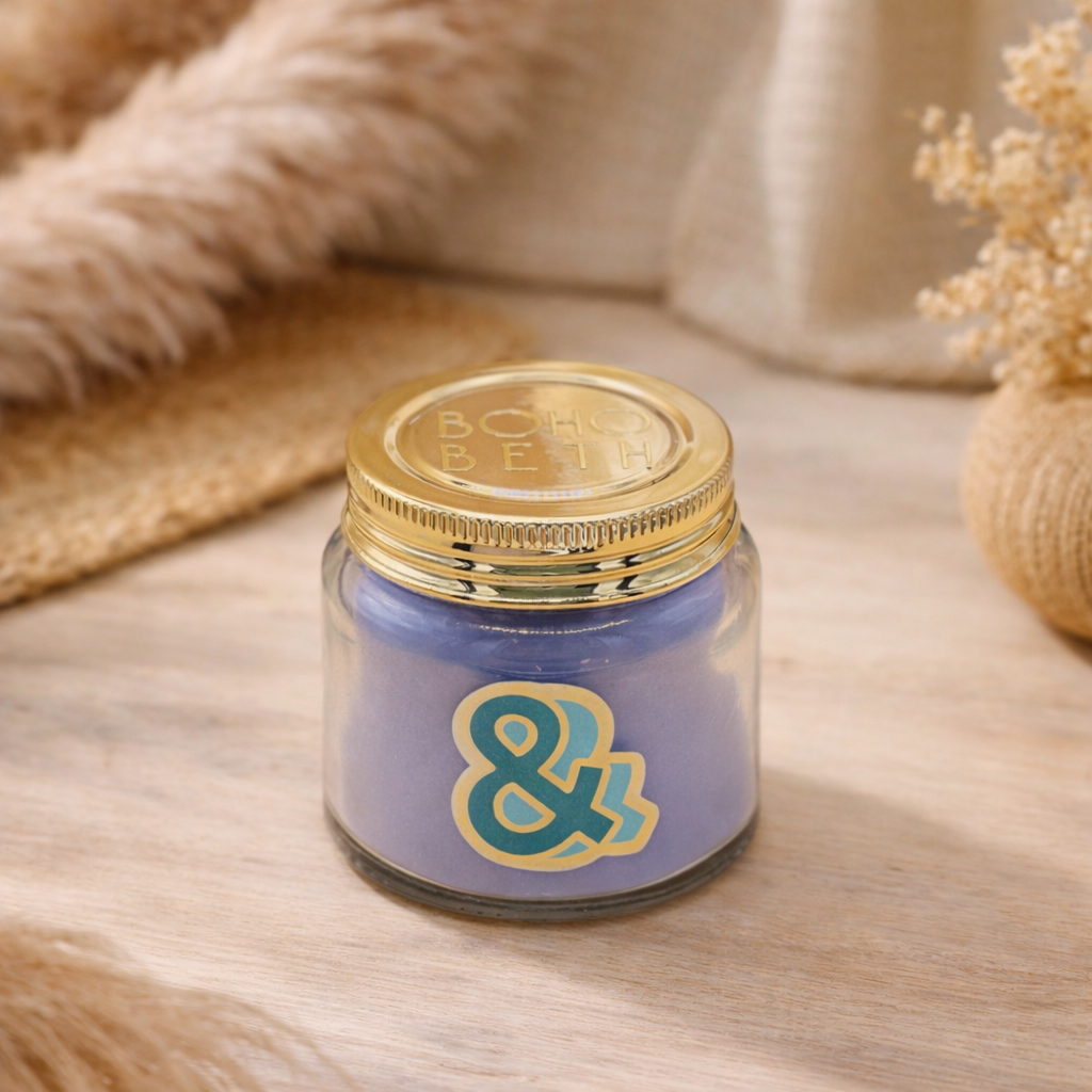 Personalised colour pop ampersand candle jar with pastel wax and gold lid on bohemian background