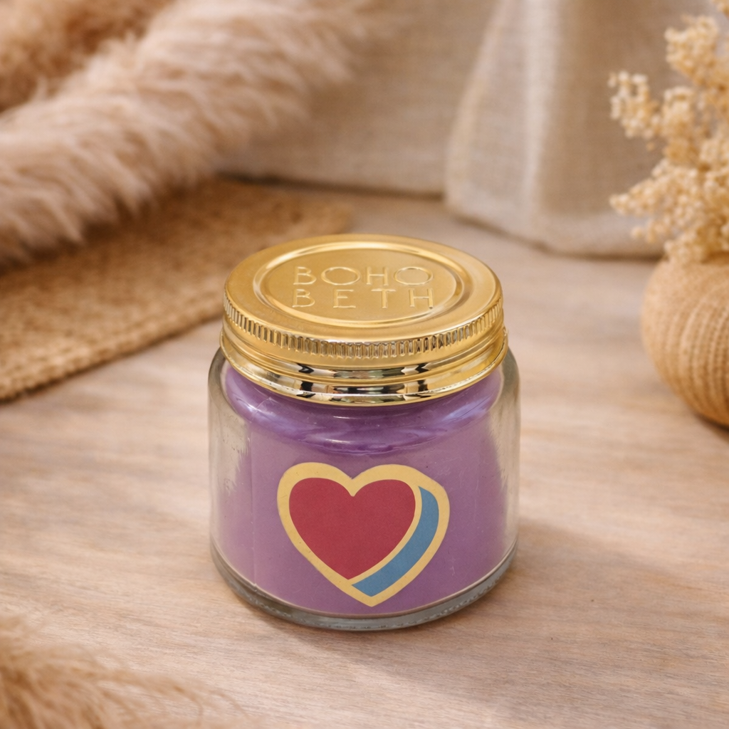 Personalised colour pop heart candle jar with pastel wax and gold lid on bohemian background