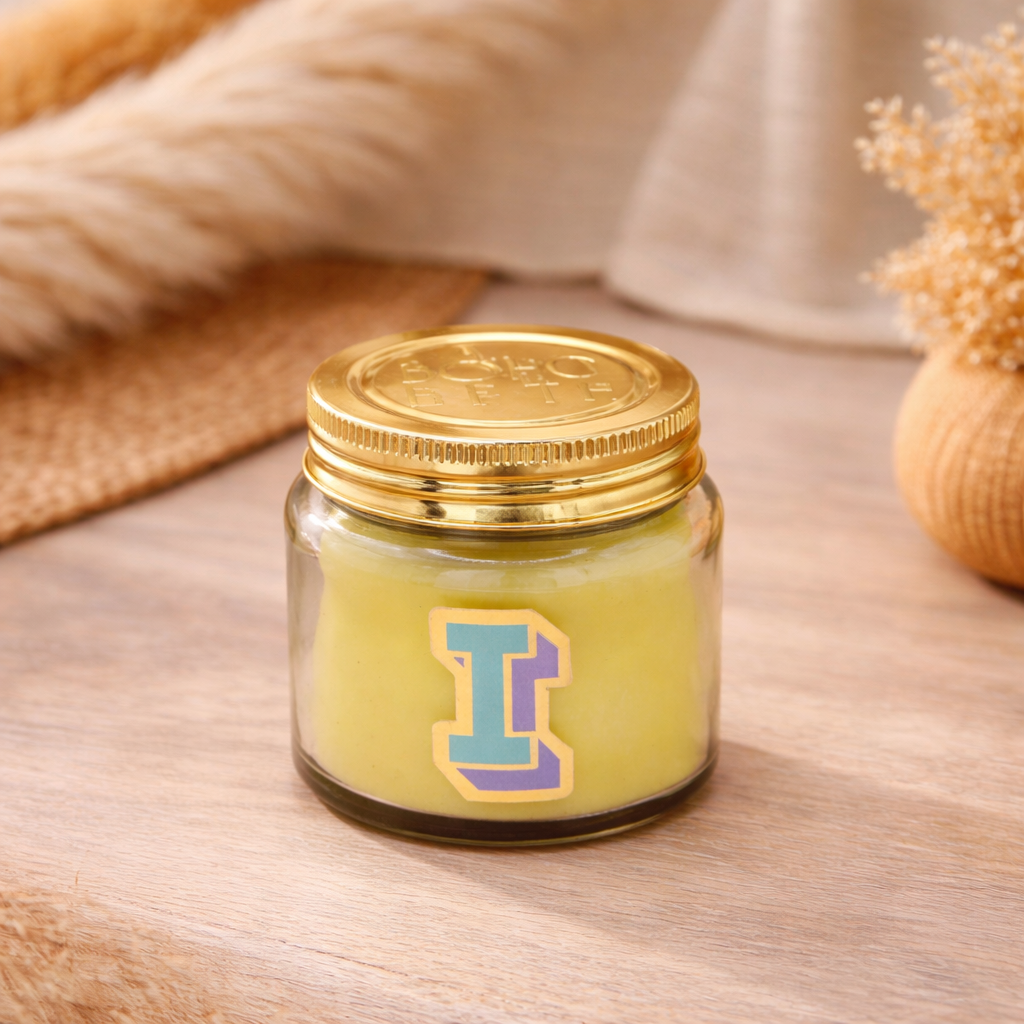 Personalised colour pop letter I candle jar with pastel wax and gold lid on bohemian background