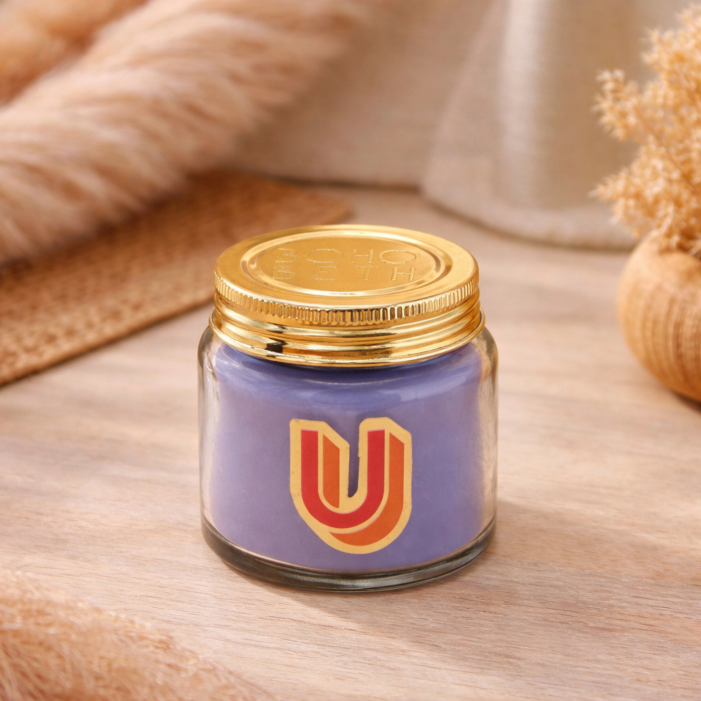 Personalised colour pop letter u candle jar with pastel wax and gold lid on bohemian background